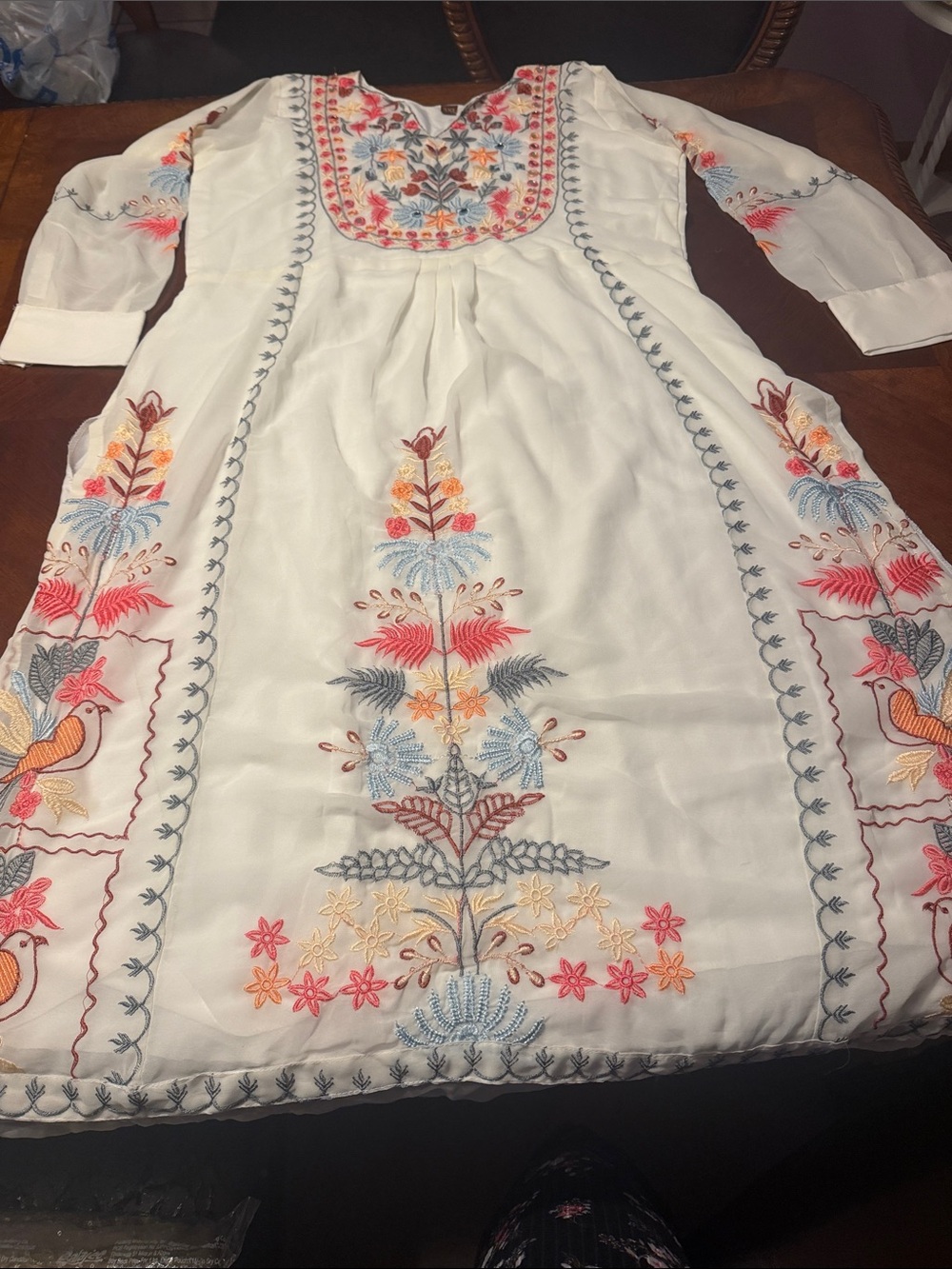 White Embroidered Indian 3 piece suit with Multicolor Floral accents.